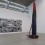 (Left) Liu Wei, "Camouflage Landscape", oil on canvas, 300 x 210 cm x 3 pieces (triptych), 2006（左）刘韡，《迷彩山水》，布面油画，300 cm x 210 cm x 3 (三联画)，2006(Right／右) Sterling Ruby 斯特林•鲁比, "Monument Stalagmite/WE LUV STRUGGLING", PVC pipe, foam, urethane, wood, spray paint, 558.8 cm x 96.5 cm x 157.5 cm, 2013
