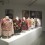 Jakkai Siributr, "Transient Shelter", 10 digital prints, single-channel video, 10 uniform jackets embellished with various objects, 2014