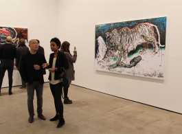 Sun Xun (L), talks to a visitor at the opening of "The Time Vivarium” at Sean Kelly Gallery, New York.