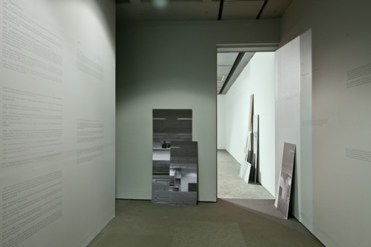 Hito Steyerl, installation view. “Adorno’s Grey (2012)”, Single Channel HD video projection, 00:14:20, Four angled screens, wall plot, photographs. Copyright Hito Steyerl, courtesy Wilfried Lentz Rotterdam.