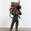 Yinka Shonibare, “Refugee Astronaut”, fibreglass mannequin, Dutch wax printed cotton
textile, net, possessions, astronaut helmet, moon, boots and steel baseplate, 208 x 93 x 90 cm, 2015.