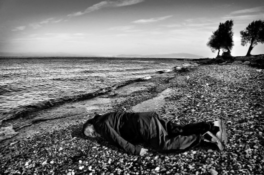 Chinese artist Ai Weiwei imitating the lifeless body of Syrian toddler Alan Kurdi on the Greek Island of Lesbos. (Rohit Chawla for India Today)