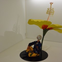 Yinka Shonibare MBE, "Boy Sitting Beside Hibiscus Flower", fibreglass mannequin, Dutch wax printed cotton textile, fibreglass, globe, leather and steel baseplate, 191 x 145 x 91 cm, 2015. (Courtesy the artist, Stephen Friedman Gallery, London and Pearl Lam Galleries, Hong Kong, Shanghai and Singapore).