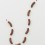 刘辛夷，《九段肠》，聚氨酯、酚醛树脂、铝棒、油画颜料，总体尺寸 290×172.5×16 cm，2016. Liu Xinyi, "Nine Segments of Sausage", polyurethane, phenolic resin, aluminium bars, oil paint, overall dimenisons, 290 × 172.5 × 16 cm, 2016
