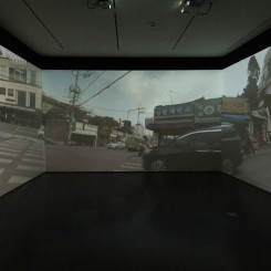 Passage/s: The Pram Project, 2015, three-channel video, dimensions variable. Installation view, Contemporary Arts Center Cincinnati. Photo by Tony Walsh. Courtesy the artist, Lehmann Maupin, New York and Hong Kong, and Contemporary Arts Center Cincinnati.