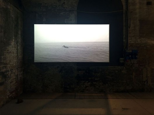 来自汤南南的《刺船（Odyssey Smoking）》截屏，黑白影像，2013，中国馆 Still from Tang Nannan Odyssey Smoking, Black and White Video, 2013, Chinese Pavilion