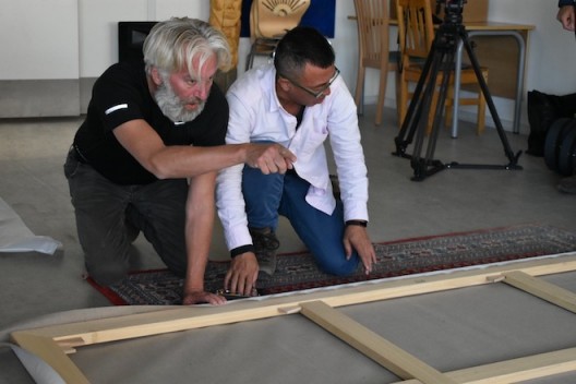 Liu Xiaodong and Jens stretching the canvas for a painting made on their expedition to Greenland July 2017