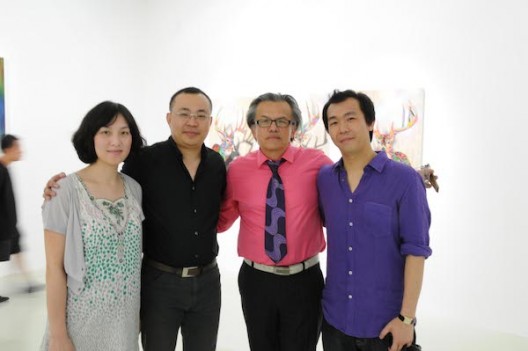 The artist GORDON CHEUNG pictured (furthest right) at his 2010 solo exhibition at Shanghai’s Other Gallery with, from right to left, curator RAUL ZAMUDIO, Other Gallery owner and How Art Museum founder ZHENG HAO, and Zheng’s wife. Courtesy the artist.