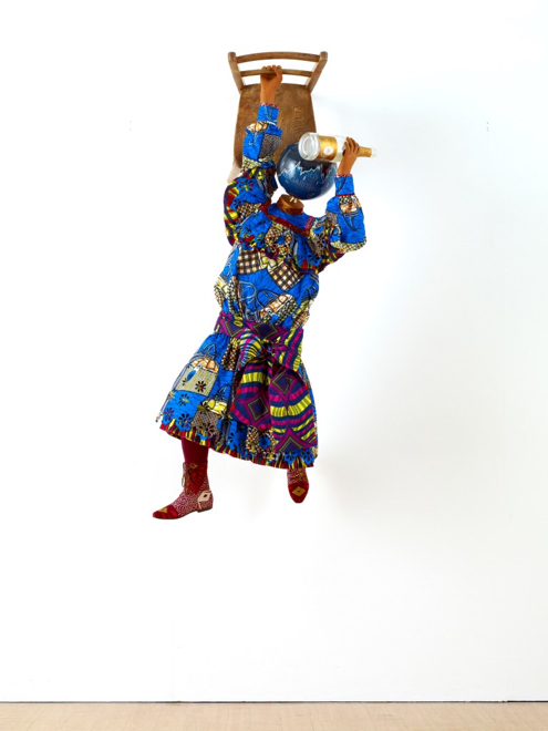 Yinka Shonibare MBE, Champagne Kid 6, unique life-size mannequin, Dutch wax printed cotton textile, leather, resin, chair, globe and Cristal champagne bottle, 178 x 85 x 76cmcm, 2013