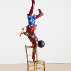 Yinka Shonibare MBE, Champagne Kid 6, unique life-size mannequin, Dutch wax printed cotton textile, leather, resin, chair, globe and Cristal champagne bottle, 178 x 85 x 76cmcm, 2013