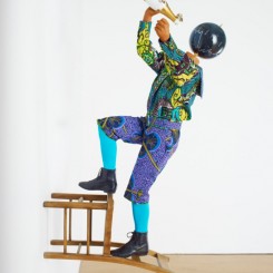 Yinka Shonibare MBE, Champagne Kid 8, unique life-size mannequin, Dutch wax printed cotton textile, leather, resin, chair, globe and Cristal champagne bottle, 178 x 85 x 76cmcm, 2013