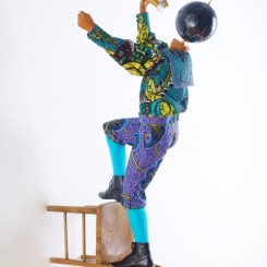 Yinka Shonibare MBE, Champagne Kid 8, unique life-size mannequin, Dutch wax printed cotton textile, leather, resin, chair, globe and Cristal champagne bottle, 178 x 85 x 76cmcm, 2013