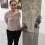 Sakshi Gupta with her work "Strange Beginnings I", stone and feathers,  
variable dimensions, 2013