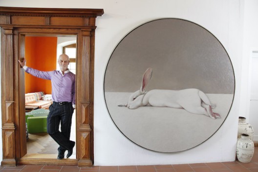 Uli Sigg at home with Shao Fan's Moon Rabbit, 2010, oil on canvas, dia. 220 cm (image HUG Karl-Heinz)