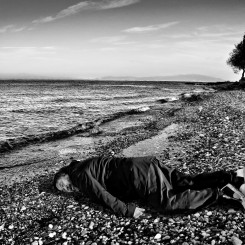 Chinese artist Ai Weiwei imitating the lifeless body of Syrian toddler Alan Kurdi on the Greek Island of Lesbos. (Rohit Chawla for India Today)