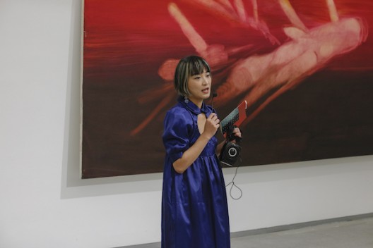 Curator Weng Xiaoyu at the opening